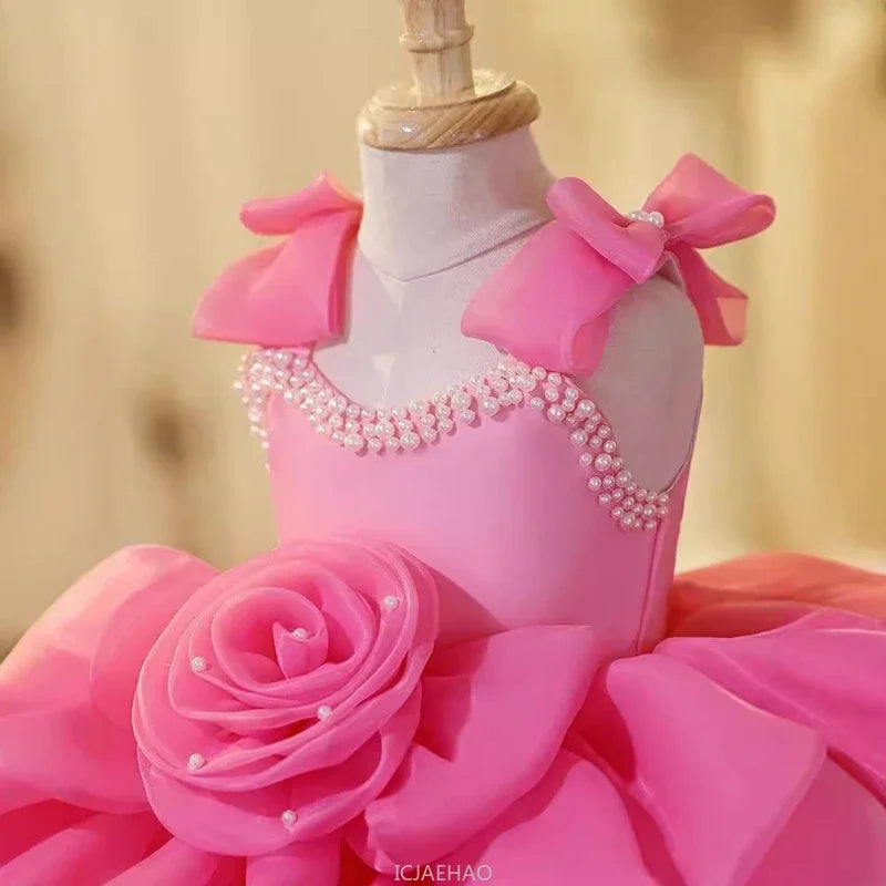 Vestido infantil rosa de lujo con lazos