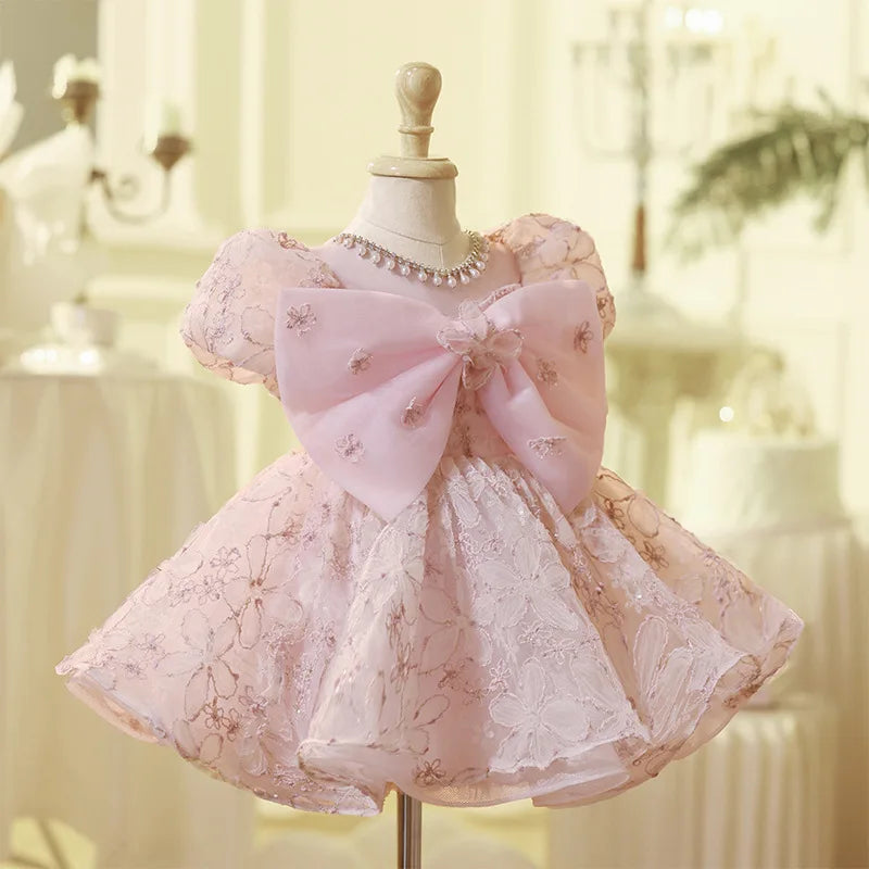 Vestido de fiesta infantil con lazo rosado encantado