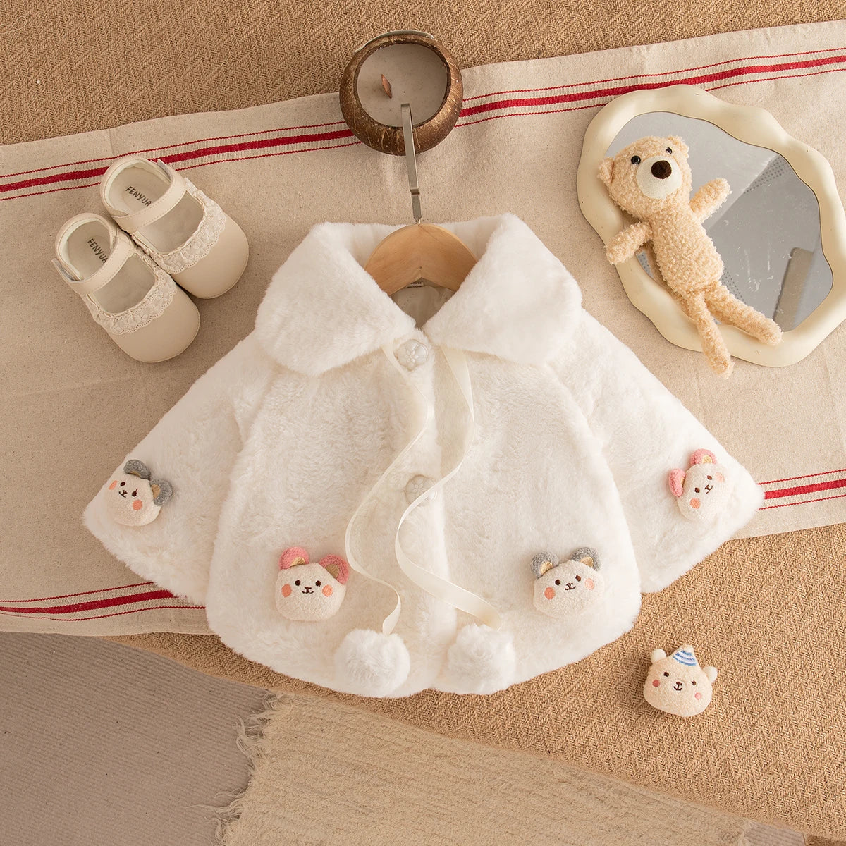 Ivory baby girl faux fur cape with teddy bear appliqués and flower buttons
