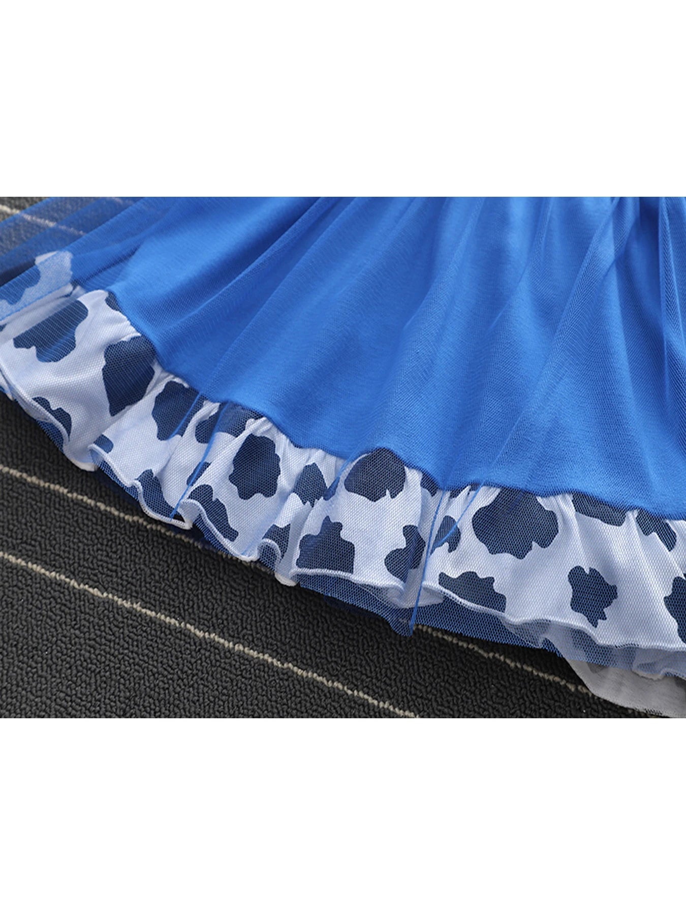 Playful cowgirl print bodice on a girls' tulle dress