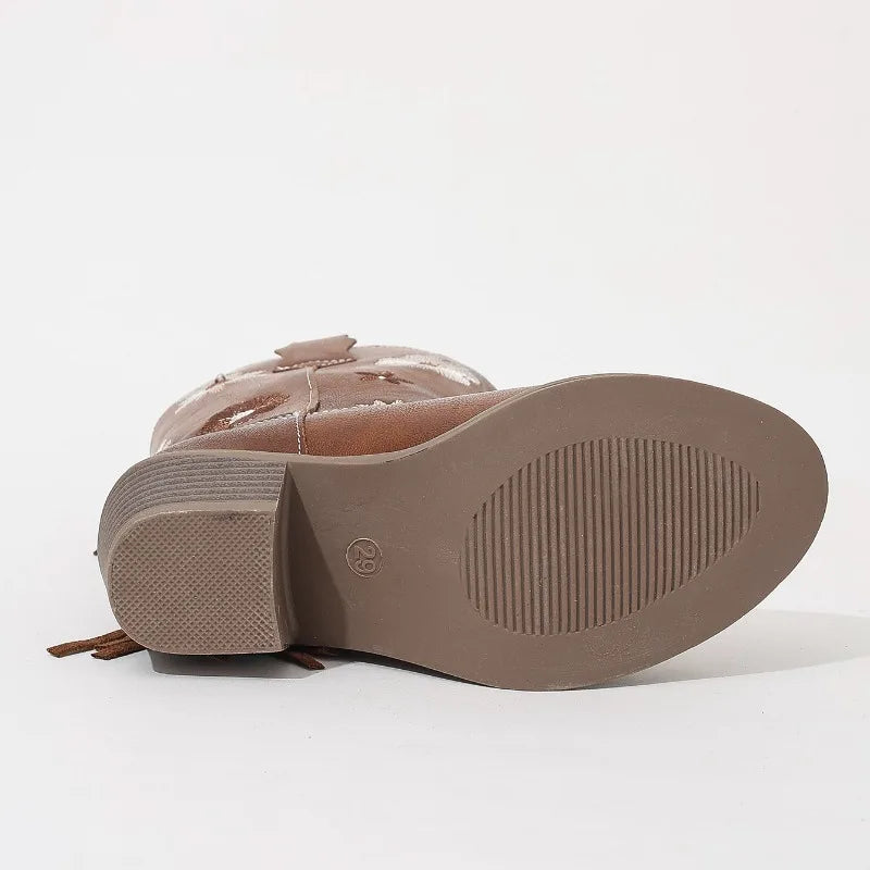Side view of girls' western boots with low heel and fringe detail