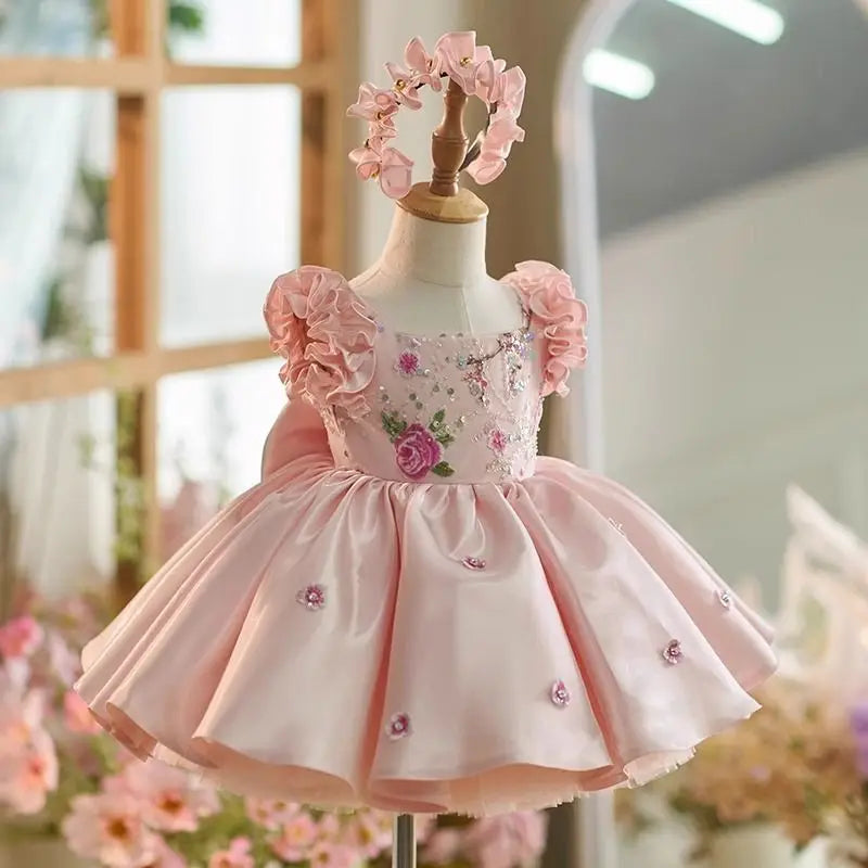 Pink satin flower girl princess dress with ruffle sleeves and floral embroidery, front view