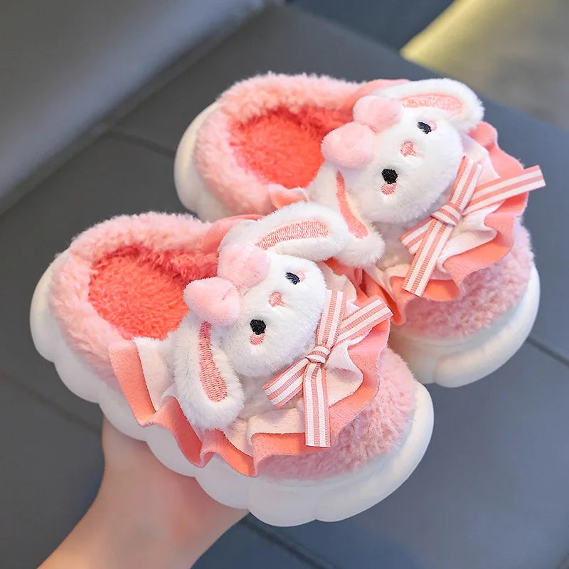 Coral pink fluffy bunny slippers for girls with ruffle trim and bow