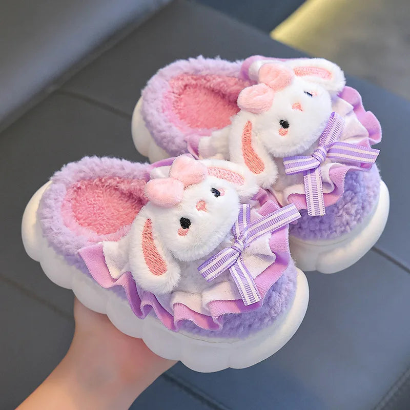 Pair of lavender bunny plush slippers with ruffles and chunky cloud sole