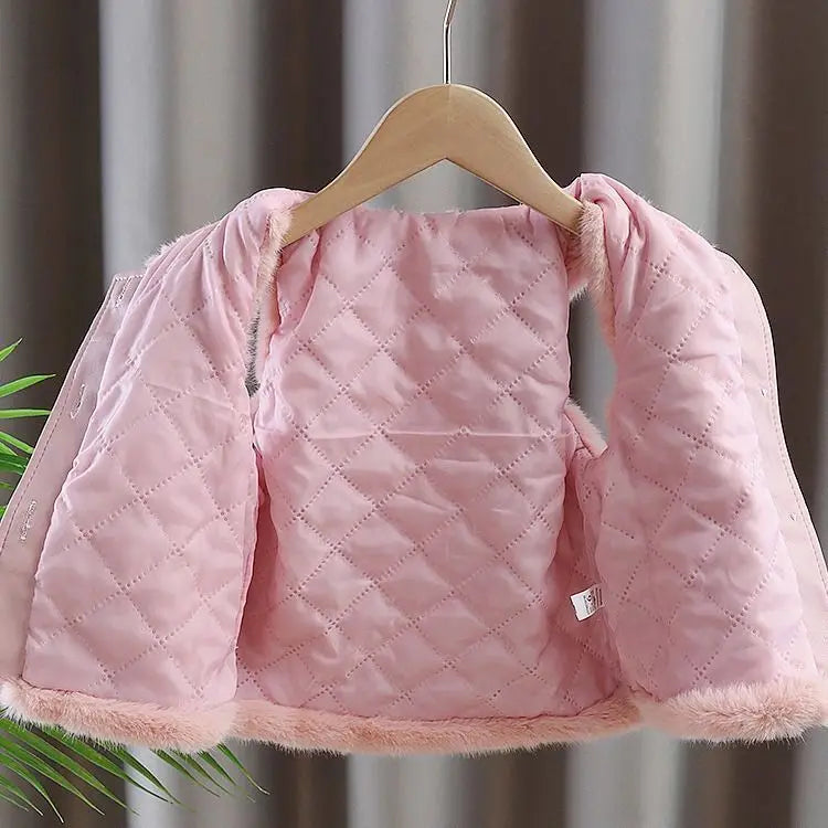 Quilted pink lining inside the girls faux fur vest