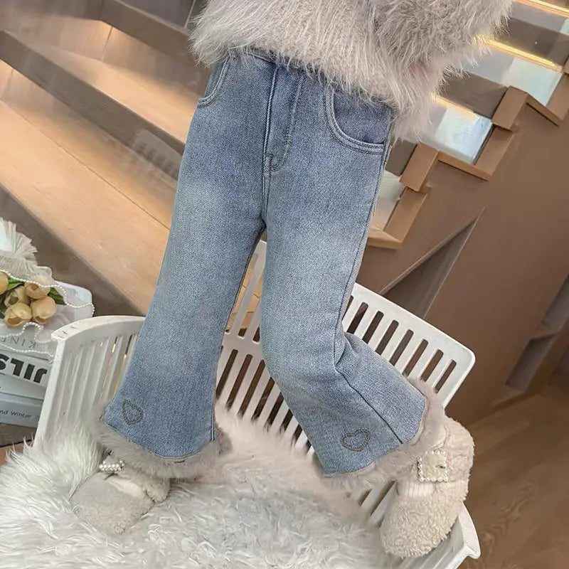 Embroidered heart near the ankle on girls fleece-lined flare jeans