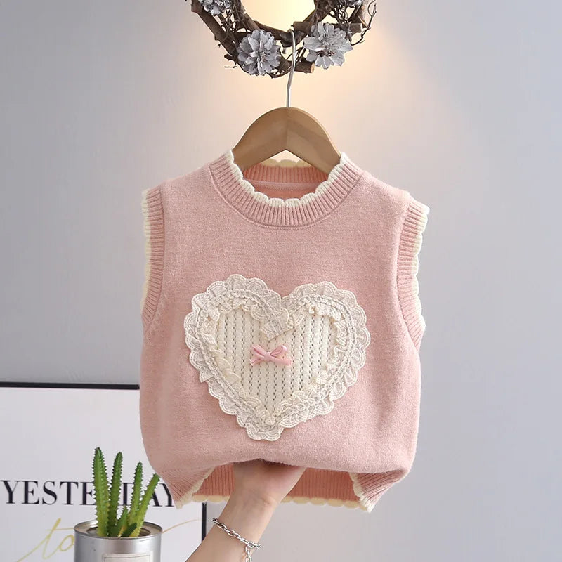 Blush pink girls knit sweater vest with lace heart and pink bow