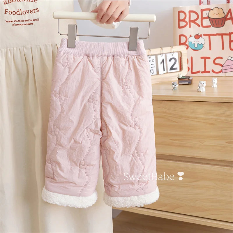 Back view of blush pink girls quilted winter pants with sherpa cuffs