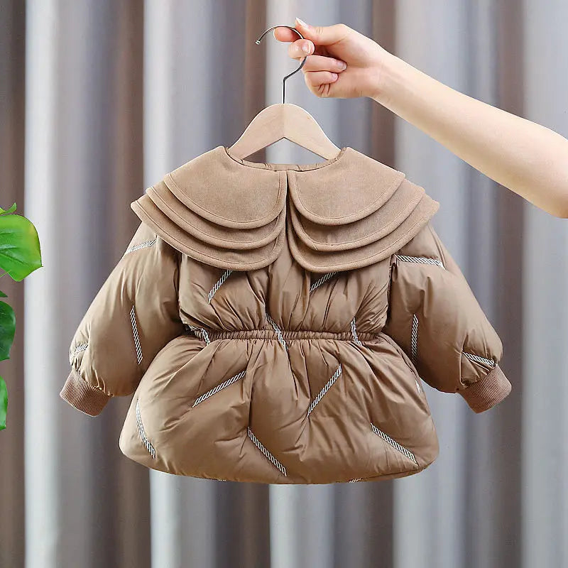 Toddler girl winter puffer coat in camel, close-up of the three-tier ruffle collar and button front
