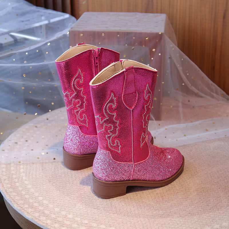 Sparkly pink western cowgirl boots for girls shown from the side, showing the classic riding-boot silhouette