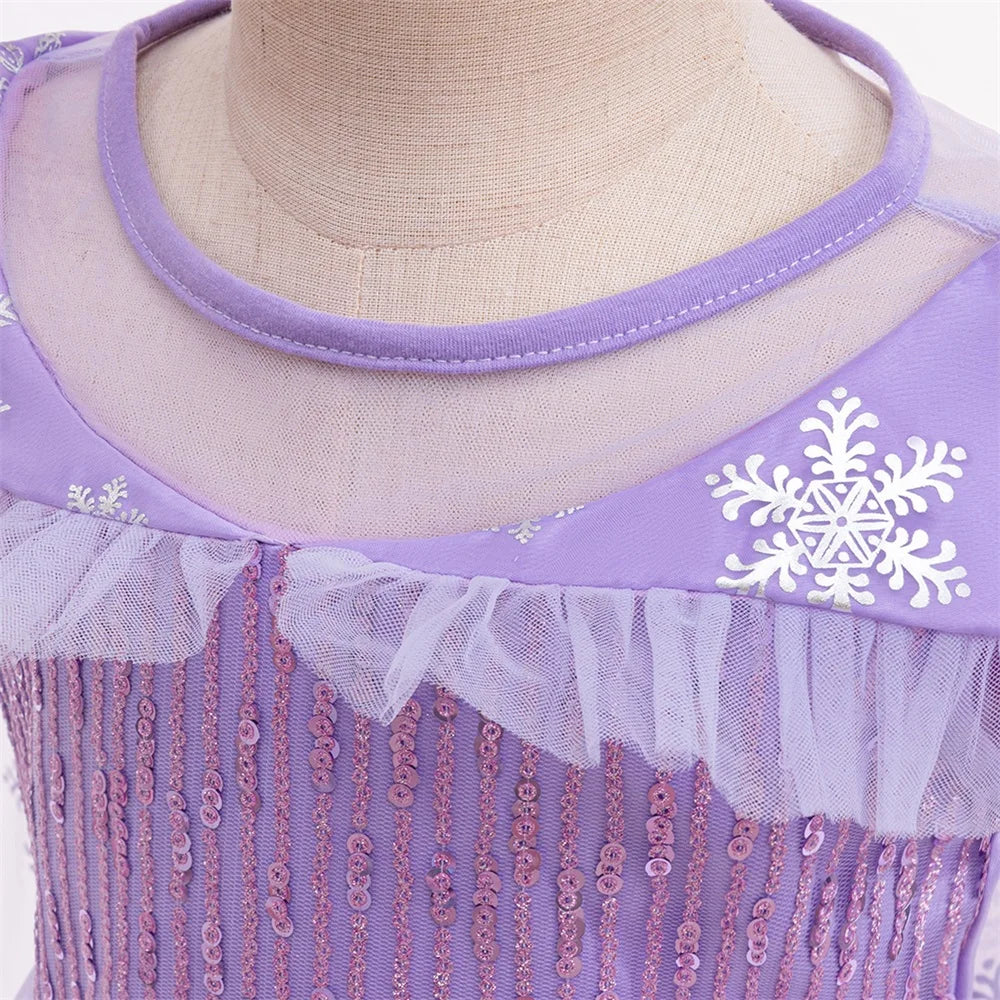 Little girl in a sparkling purple snow princess party dress for birthdays and dress-up