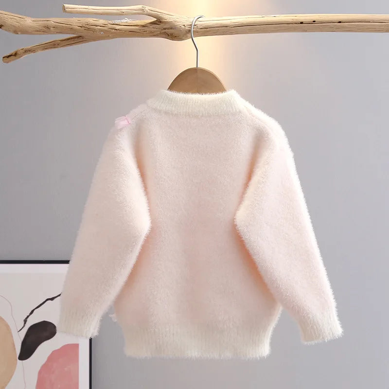 Long-sleeve knit pullover for girls with sweet ruffle trim