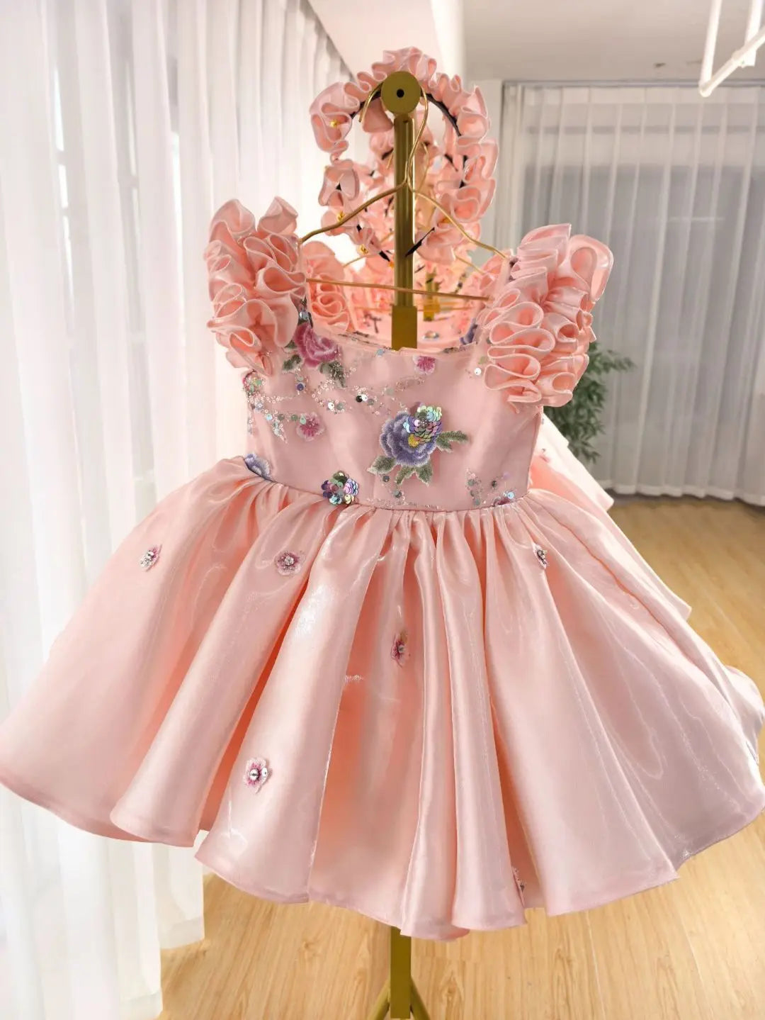 Toddler girl pink satin party dress with ruffled petal sleeves and embroidered flowers