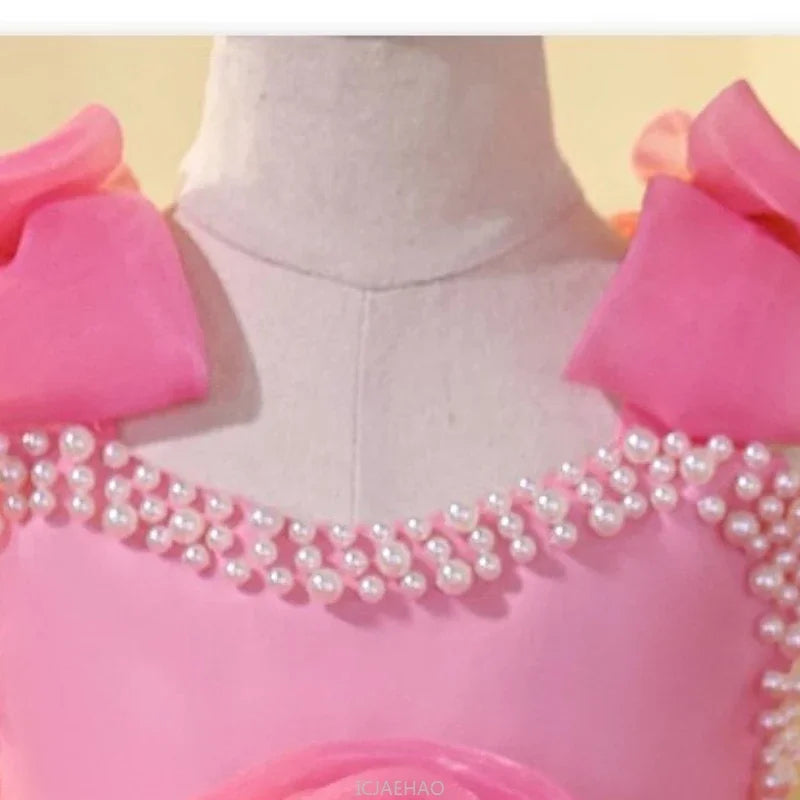 Vestido infantil rosa de lujo con lazos