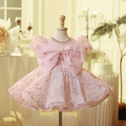 Vestido de fiesta infantil con lazo rosado encantado 