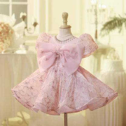 Vestido de fiesta infantil con lazo rosado encantado 