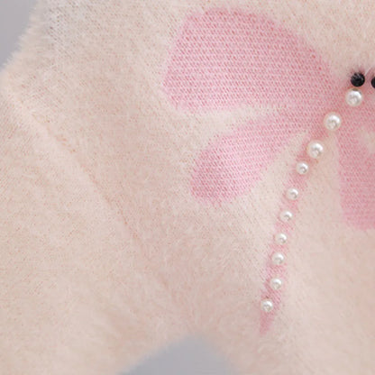 Maglione lavorato a maglia con libellula di perle 