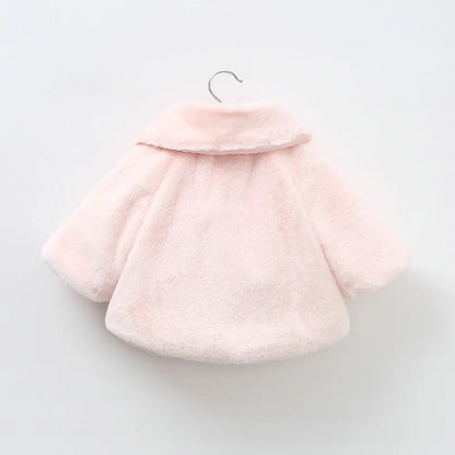 Back view of the blush pink baby faux fur swing coat