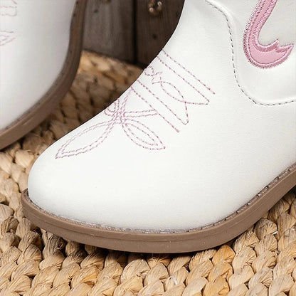 Side view of pink-trimmed cowgirl boots showing the easy zip closure