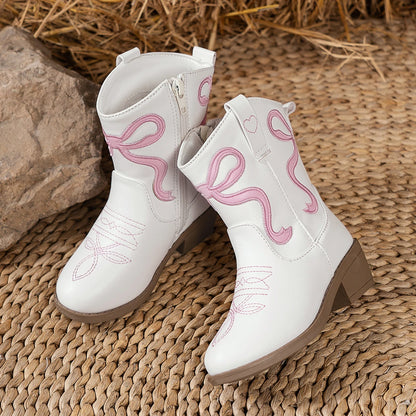 Pair of charming girls' cowgirl booties ready for little adventures