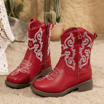 Close-up of cute embroidery on girls' western cowgirl boots