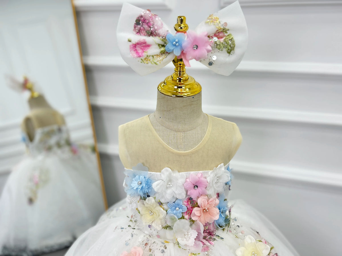 Close-up of the sheer illusion neckline and 3D flower bodice on the flower girl dress