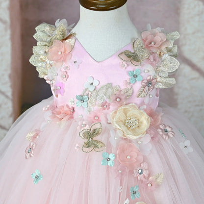 Close-up of the 3D flowers and pearls on the pink flower girl tulle dress