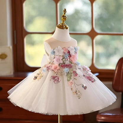 Side-back view of the girls tulle princess dress with floral bow