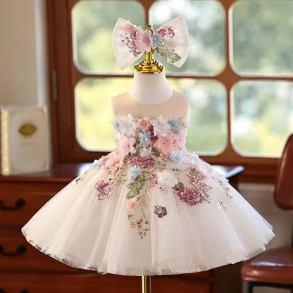 White tulle flower girl princess dress with pink and blue 3D floral appliqués, front view