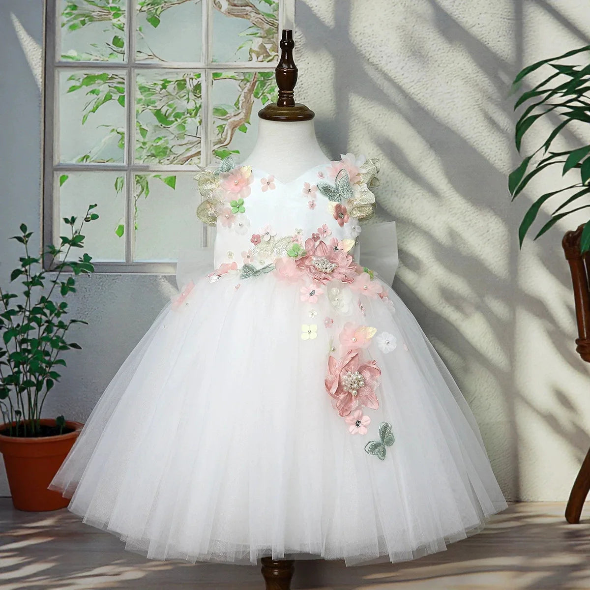 Ivory flower girl tulle princess gown with 3D flowers, front view