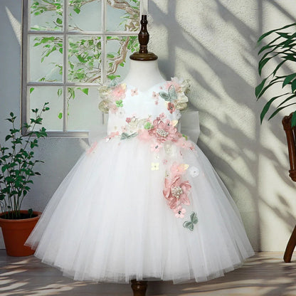 Ivory flower girl tulle princess gown with 3D flowers, front view