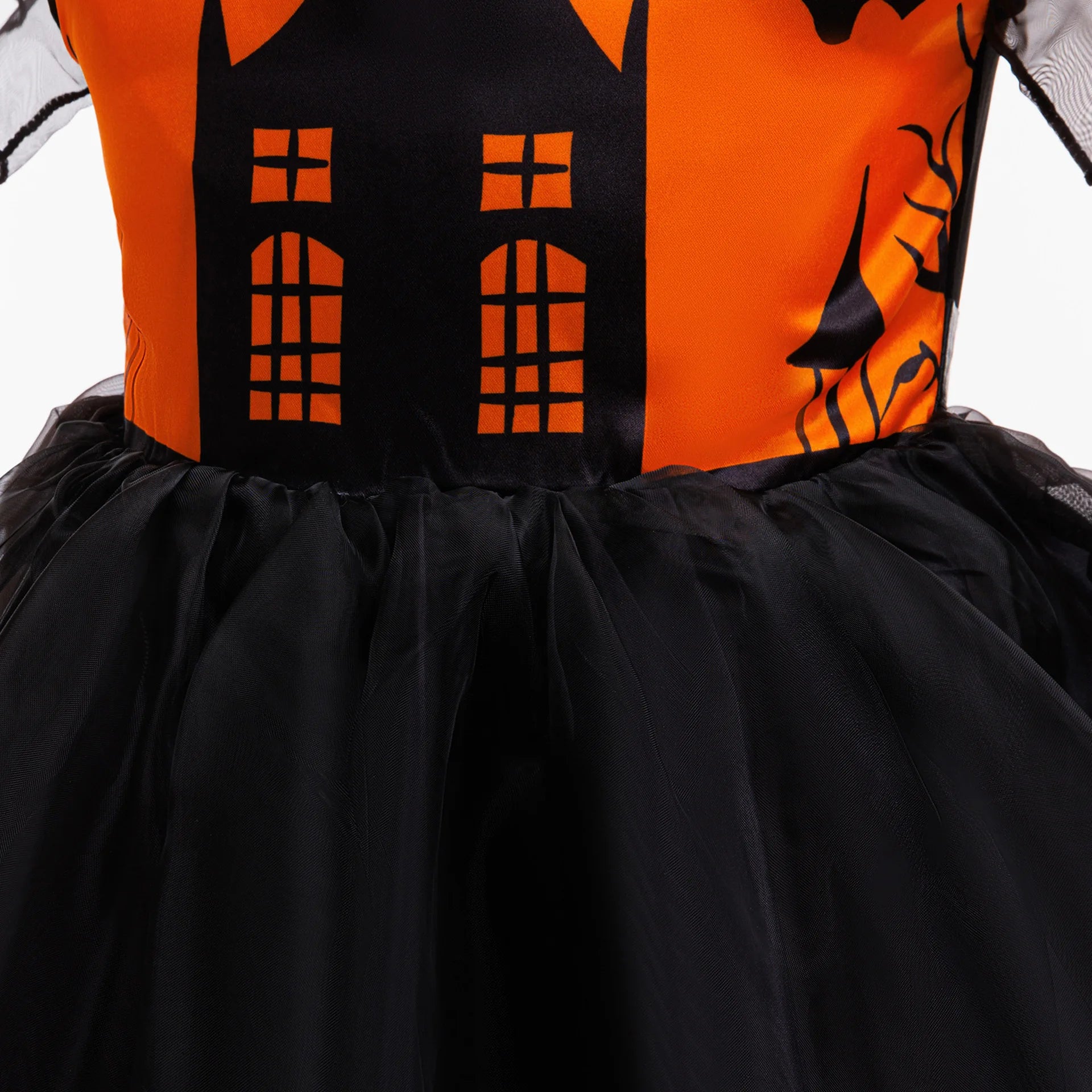 Girl twirling in orange black mesh Halloween tutu dress