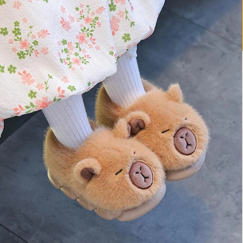 Little girl wearing fluffy capybara plush slippers with white socks