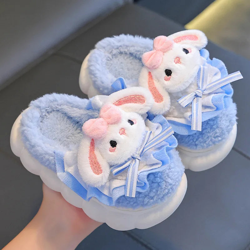 Sky blue plush bunny slippers for girls with ruffle trim and striped bow
