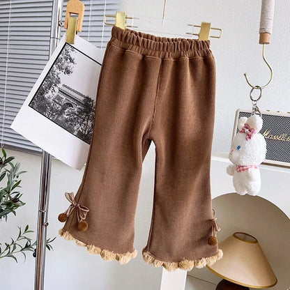 Mocha brown girls corduroy flare pants with pom-pom hem