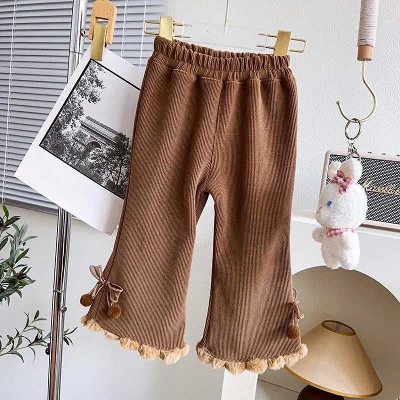 Mocha brown girls corduroy flare pants with pom-pom hem