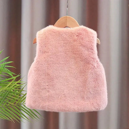 Back view of the blush pink girls faux fur vest