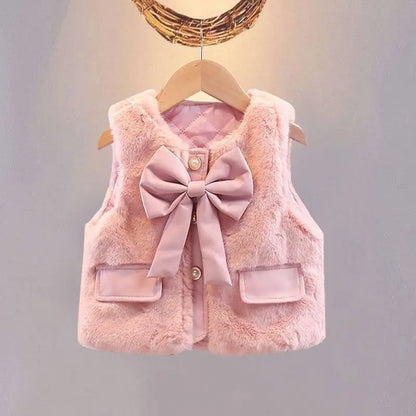 Blush pink girls faux fur vest with big bow, pearl buttons and pocket flaps