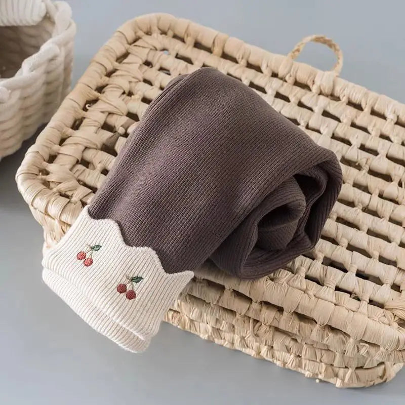 Mocha brown girls fleece-lined leggings with cherry embroidery