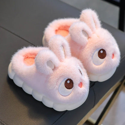 Side view of blush pink bunny plush slippers with non-slip cloud sole