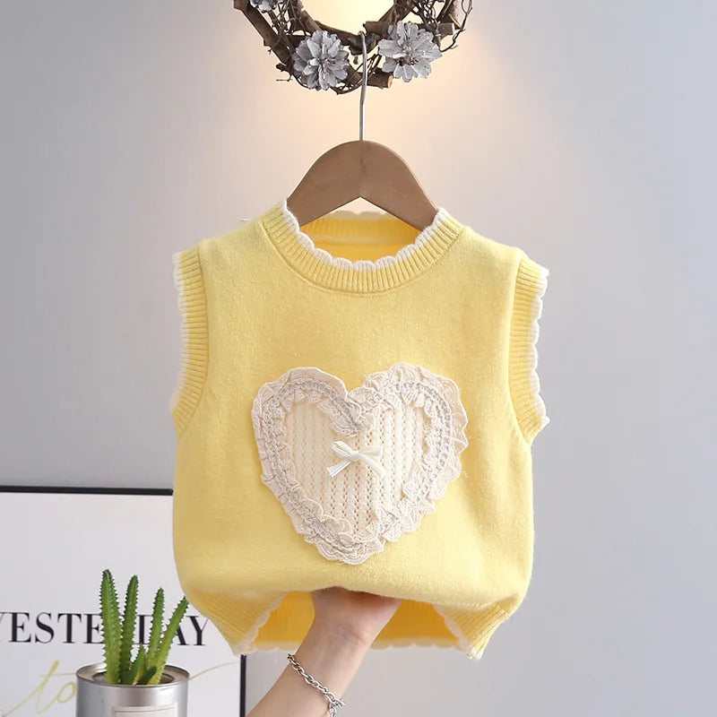 Butter yellow toddler girl sweater vest with ruffled lace heart appliqué