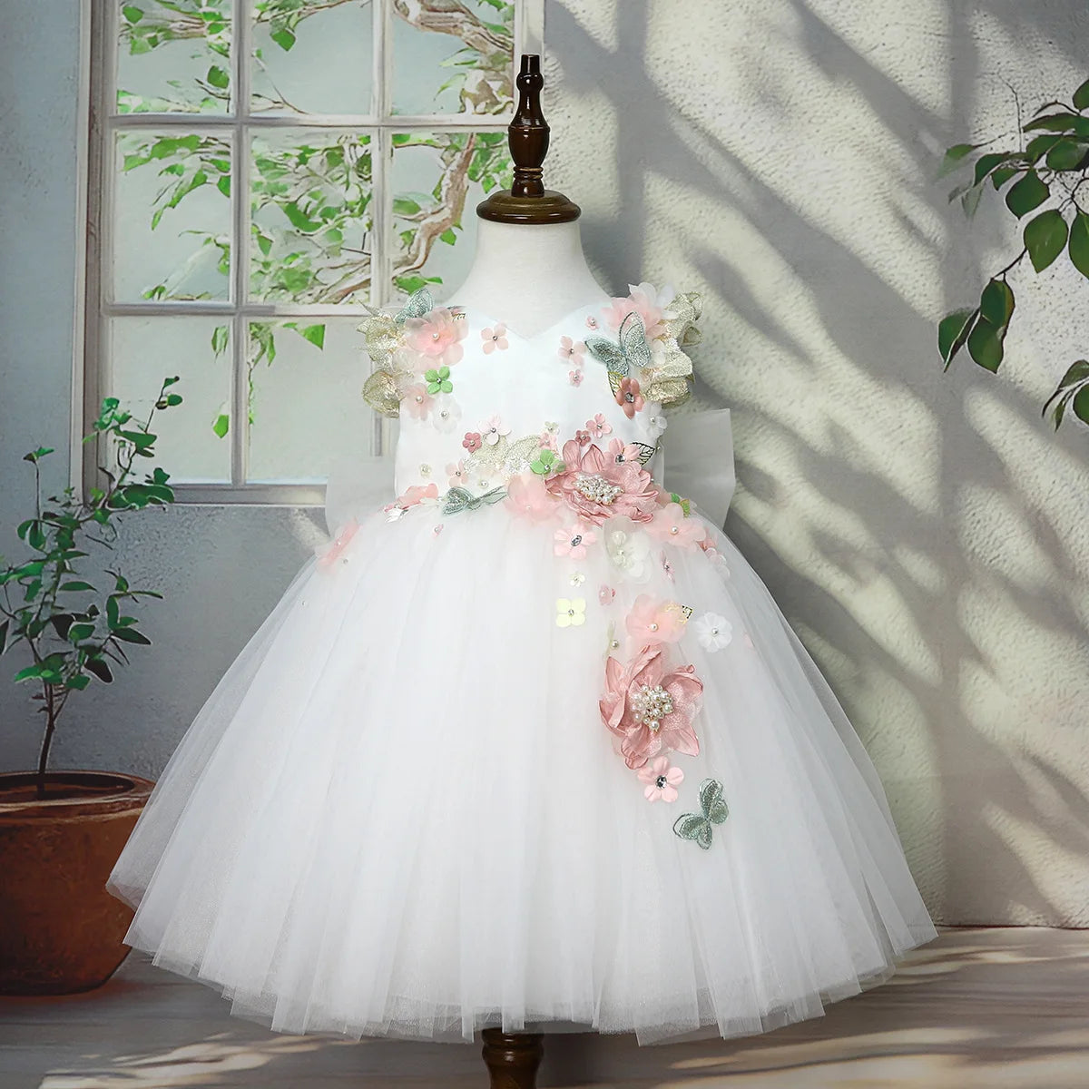 Girls ivory tulle princess gown with 3D floral appliqués for weddings