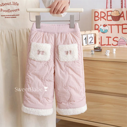 Blush pink girls quilted fleece-lined winter pants with bow pockets