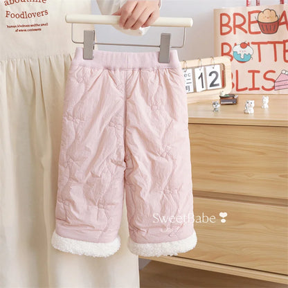 Back view of blush pink girls quilted winter pants with sherpa cuffs