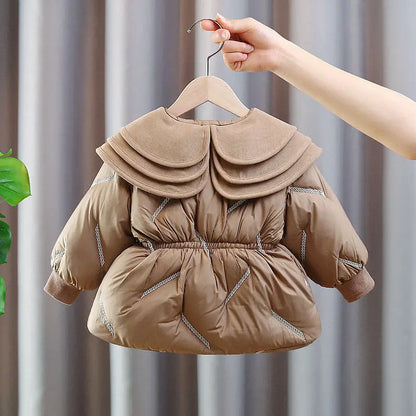 Toddler girl winter puffer coat in camel, close-up of the three-tier ruffle collar and button front