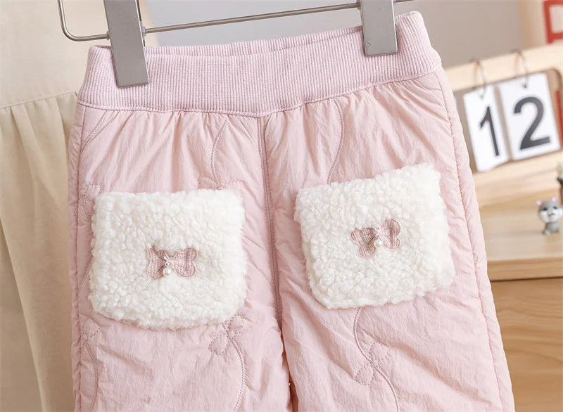 Sherpa pocket patches with embroidered bows on girls quilted fleece-lined pants