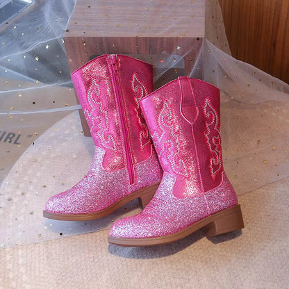 Close-up of glitter-kissed finish on girls' western cowgirl boots catching the light