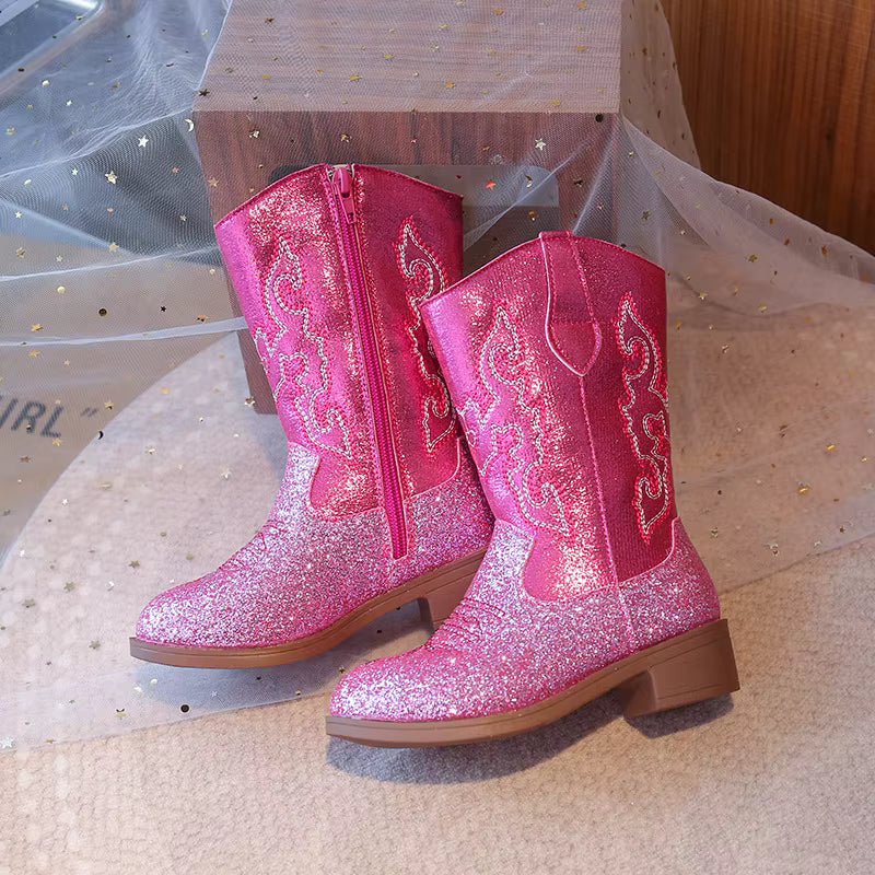 Close-up of glitter-kissed finish on girls' western cowgirl boots catching the light