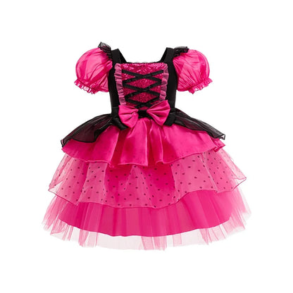 Little girl twirling in a rosy pink bubble-sleeve princess dress