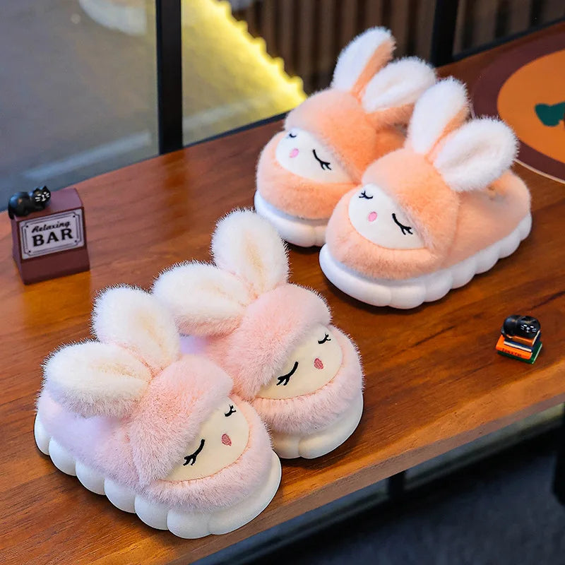Peach and blush pink kids bunny plush slippers side by side